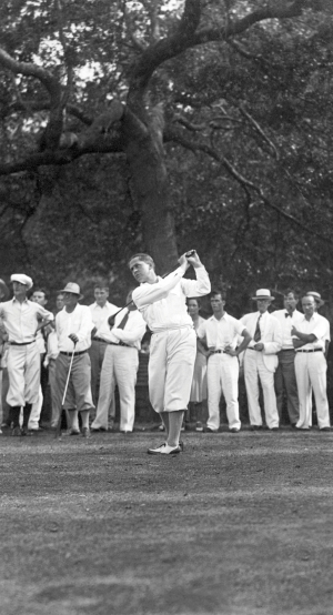 Bobby Jones playing golf around the crowd