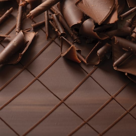 A bar of chocolate covered with shavings