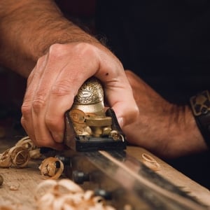 A hand planing a bamboo fly fishing rod