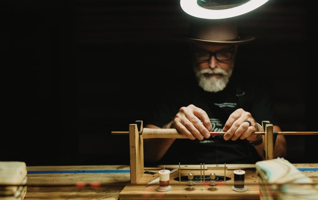 Bill Oyster meticulously crafting a bamboo rod.