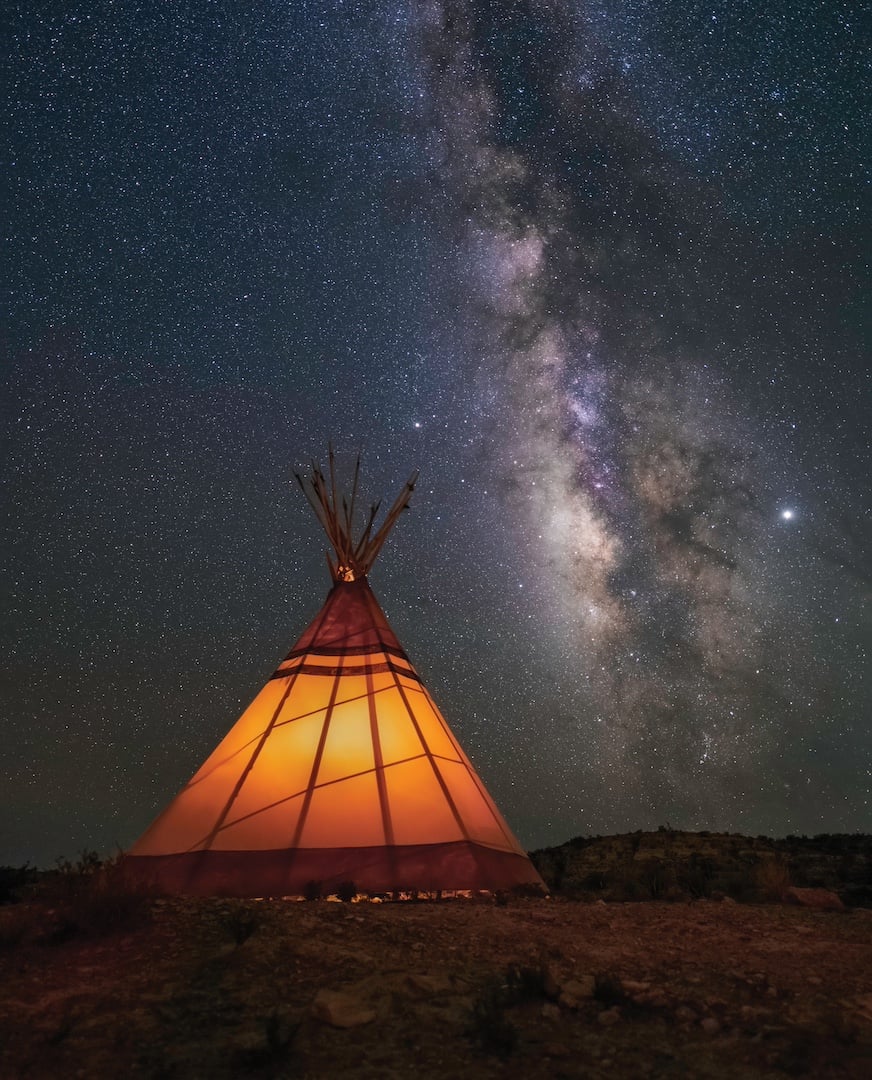 a lit teepee near the Texas/Mexico border